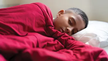 Image of a young teenager sleeping