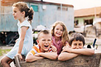 Group of children playing outdoors in a poverty district