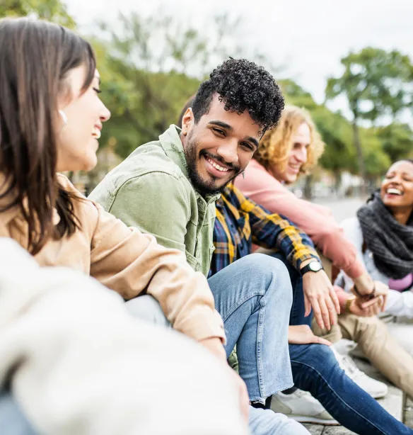 Diverse group of young people laughing together 