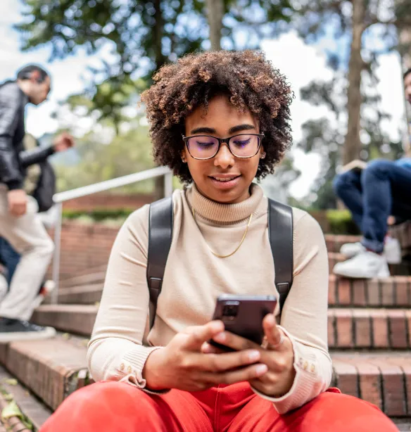 Young woman texting on a mobile phone