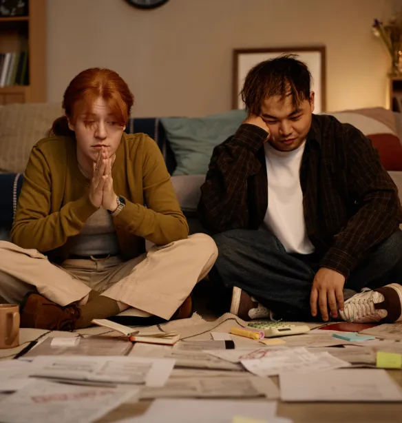 Young people looking at paperwork