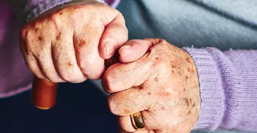 Close up of senior hands.
