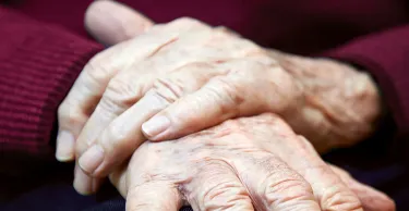 Close up of senior hands.