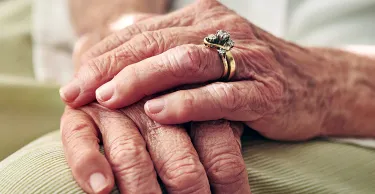 Close up of senior hands.
