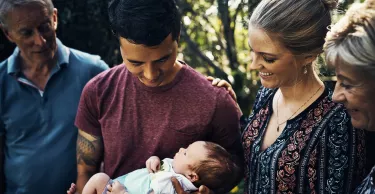 Shot of a young couple introducing their newborn baby son to his grandparents
