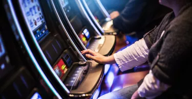 Casino Slot Gamblers. People Playing Video Slot Machines Inside Las Vegas Located Casino. Casino Slot Gamblers. People Playing Video Slot Machines Inside Las Vegas Located Casino.