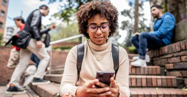 Young woman texting on a mobile phone