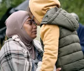 A woman and child embrace A woman and child embrace