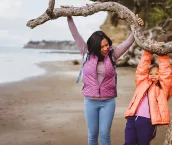 Family enjoying outdoors hiking and exploring and having fun while spending time together.