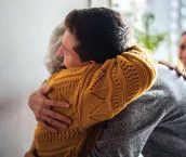 Grandmother welcoming grandson home