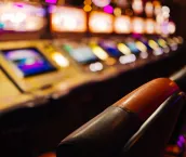 Blurry image of pokies machines inside a casino.