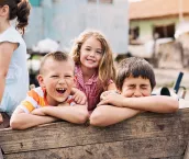 Group of children playing outdoors in a poverty district