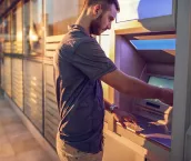 Businessman withdrawing cash from a bank's ATM