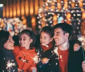 Happy young family celebrating Christmas and New Year together
