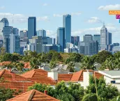 Melbourne city skyline in the distance and house roofs in the foreground Melbourne city skyline in the distance and house roofs in the foreground
