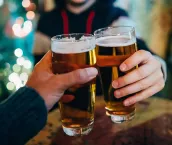 Friends drinking beer in a pub