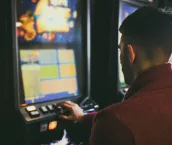 Man at pokie machine Man at pokie machine