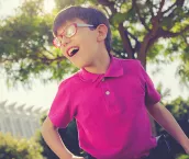 An image of a young boy using a walker An image of a young boy using a walker