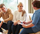 Counselor Advising Couple On Relationship Difficulties Counselor Advising Couple On Relationship Difficulties