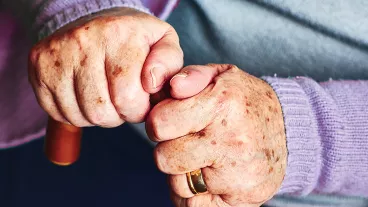 Close up of senior hands.