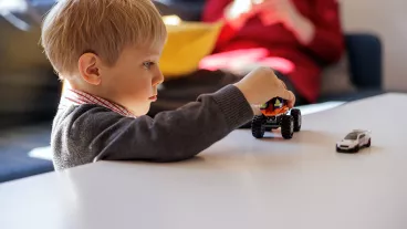 Young child plays alone Young child plays alone