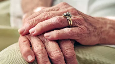 Close up of senior hands.