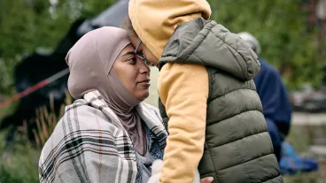 A woman and child embrace A woman and child embrace
