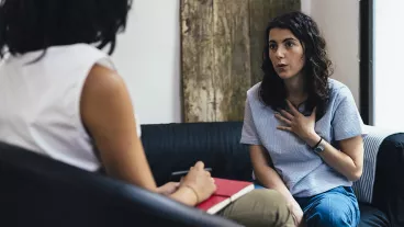 Woman talking to therapist Woman talking to therapist
