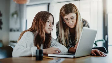 Mother and child doing homeschooling, e-learning at home because of the corona virus pandemic covid-19 quarantine Mother and child doing homeschooling, e-learning at home because of the corona virus pandemic covid-19 quarantine