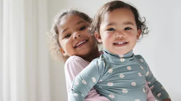 Shot of two little sisters spending time together at home. Shot of two little sisters spending time together at home.