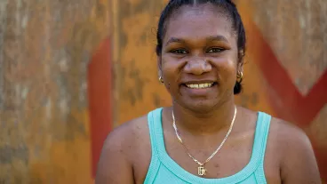 Portrait of a happy young aboriginal woman on an industrial background. Portrait of a happy young aboriginal woman on an industrial background.