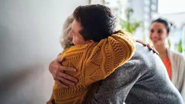 Grandmother welcoming grandson home