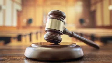 Judges gavel in court room legal trial and law background