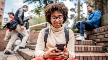 Young woman texting on a mobile phone