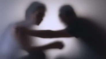 Unrecognizable sad woman and man in silhouette. Relationship problems concept.