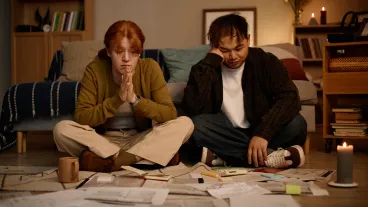 Young people looking at paperwork