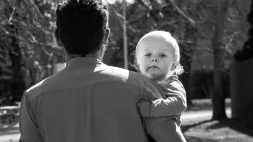 Father carrying his toddler child Father carrying his toddler child