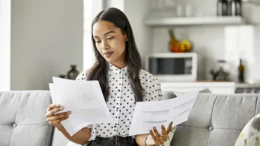 Young woman analysing documents