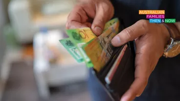 Closeup of hands taking money out of a wallet