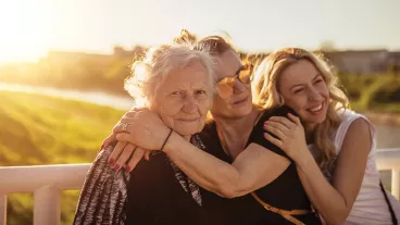 Cheerful multi-generation family enjoying in a public park