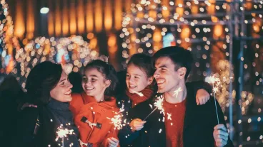 Happy young family celebrating Christmas and New Year together