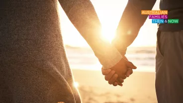 Upclose rearview shot of a young couple holding hands at the beach