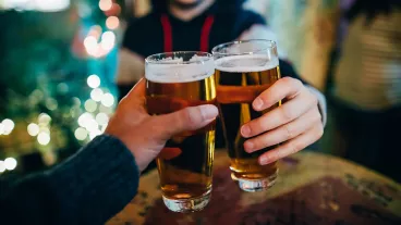 Friends drinking beer in a pub