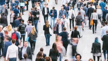 street view of pedestrians with blurred out faces.