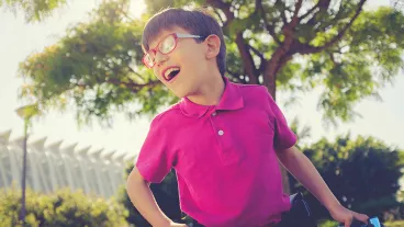 An image of a young boy using a walker