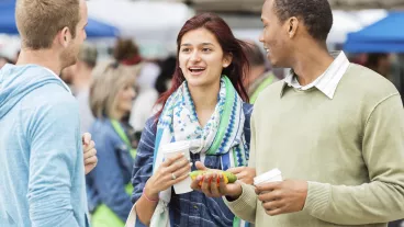 Friends talking together at the local farmers market.