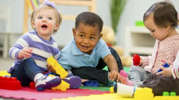 Diverse group of babies playing.