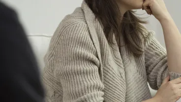 Photo of unhappy young woman on therapy