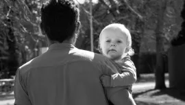 Father carrying his toddler child Father carrying his toddler child